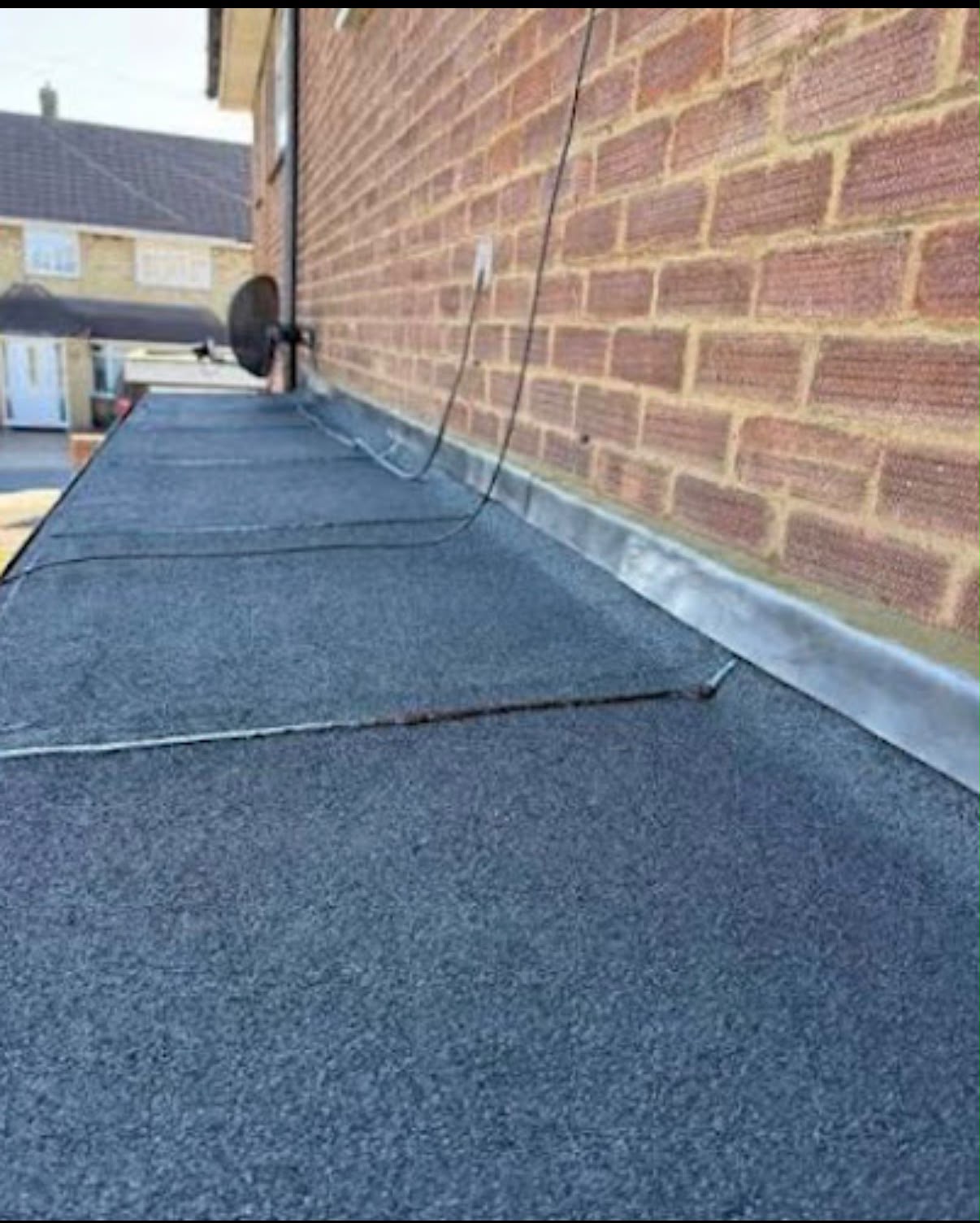 Flat felt roof with lead flashing on a Colchester property, Burton Roofing Ltd